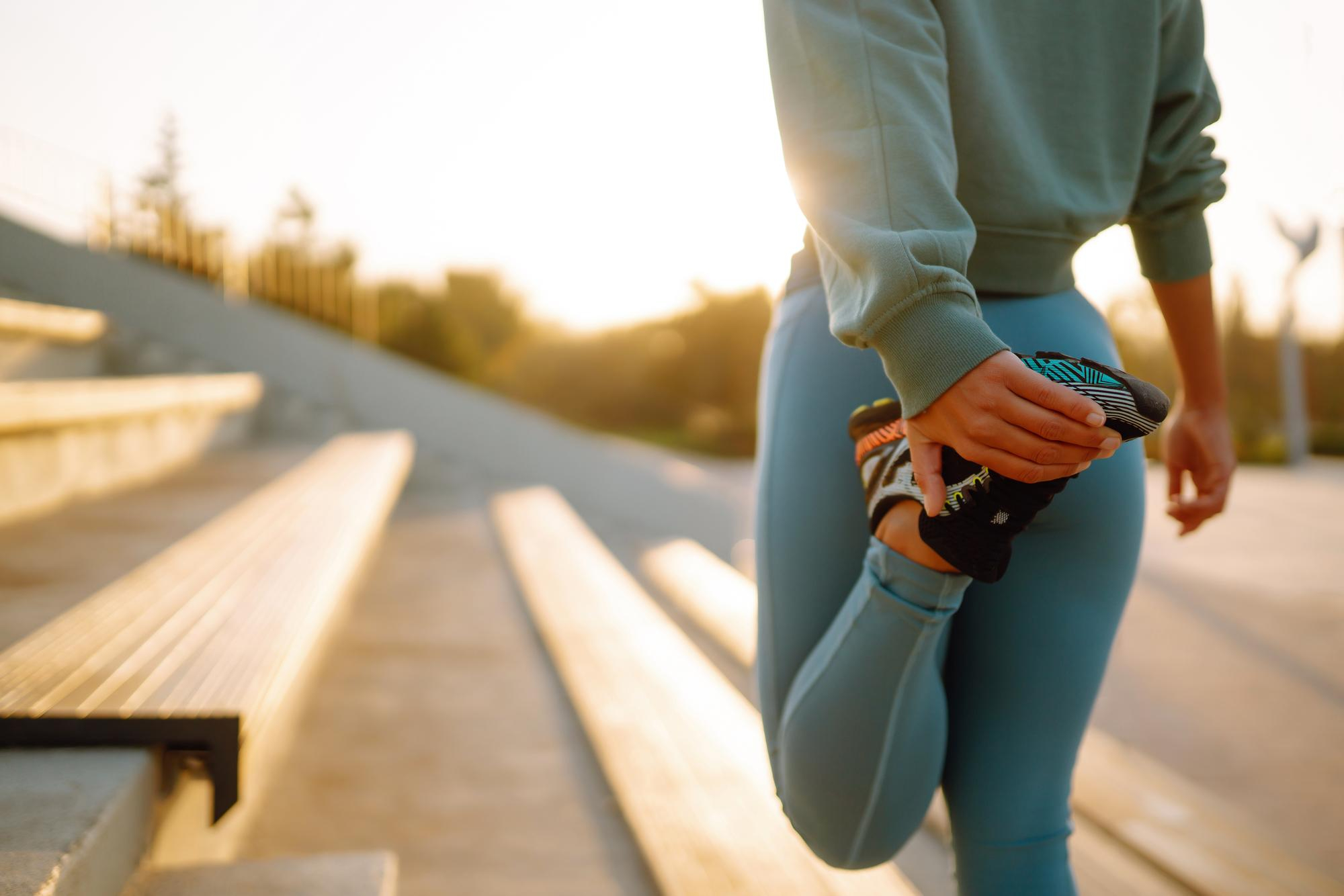 An active person walking outdoors in bright natural light